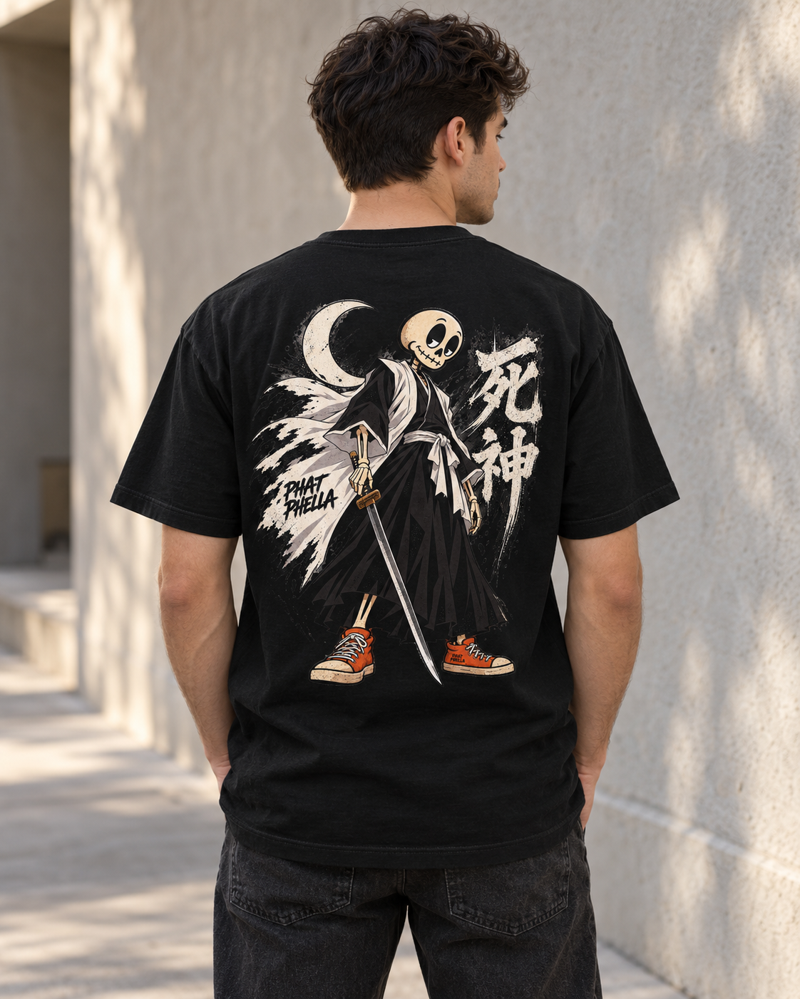 Custom lifestyle mockup of the black Powder the Soul Reaper graphic tee, shown from the back against a neutral textured wall.